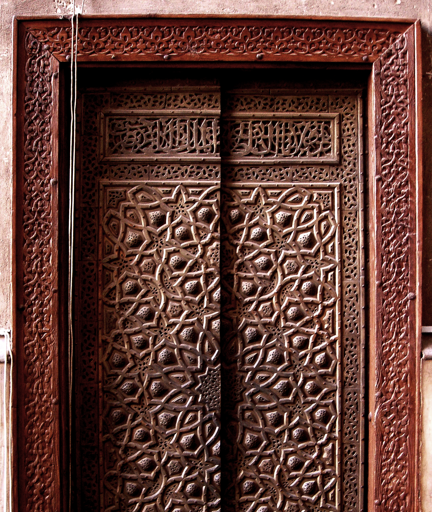 a close - up of the entrance to a carved wooden door
