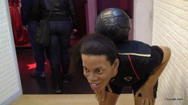 a guy making an unusual face and doing soing on the floor