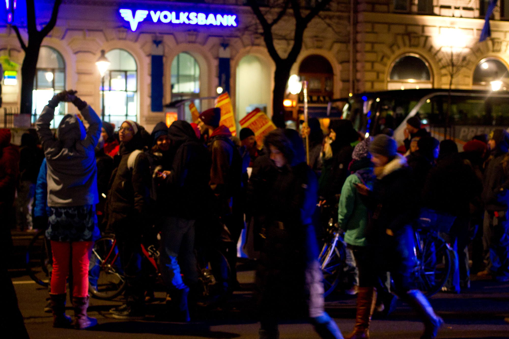 a crowd gathers in the street to celete