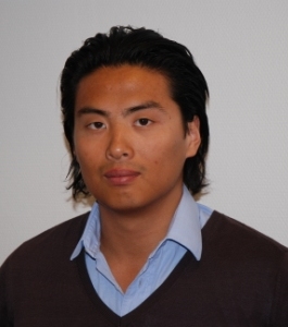 an asian man with an unoned shirt and brown sweater