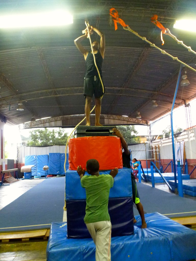 people working on a sculpture in a gym