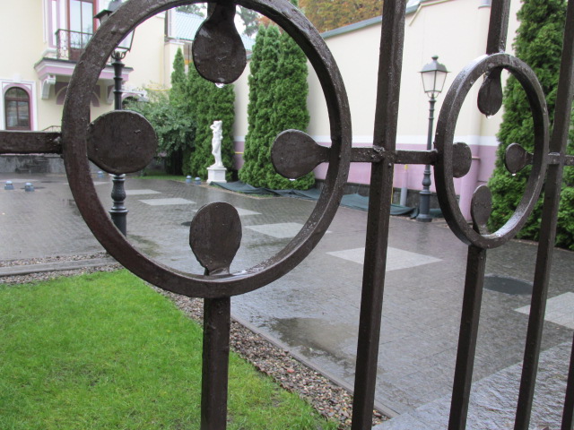 a metal gate with a circular pattern is shown
