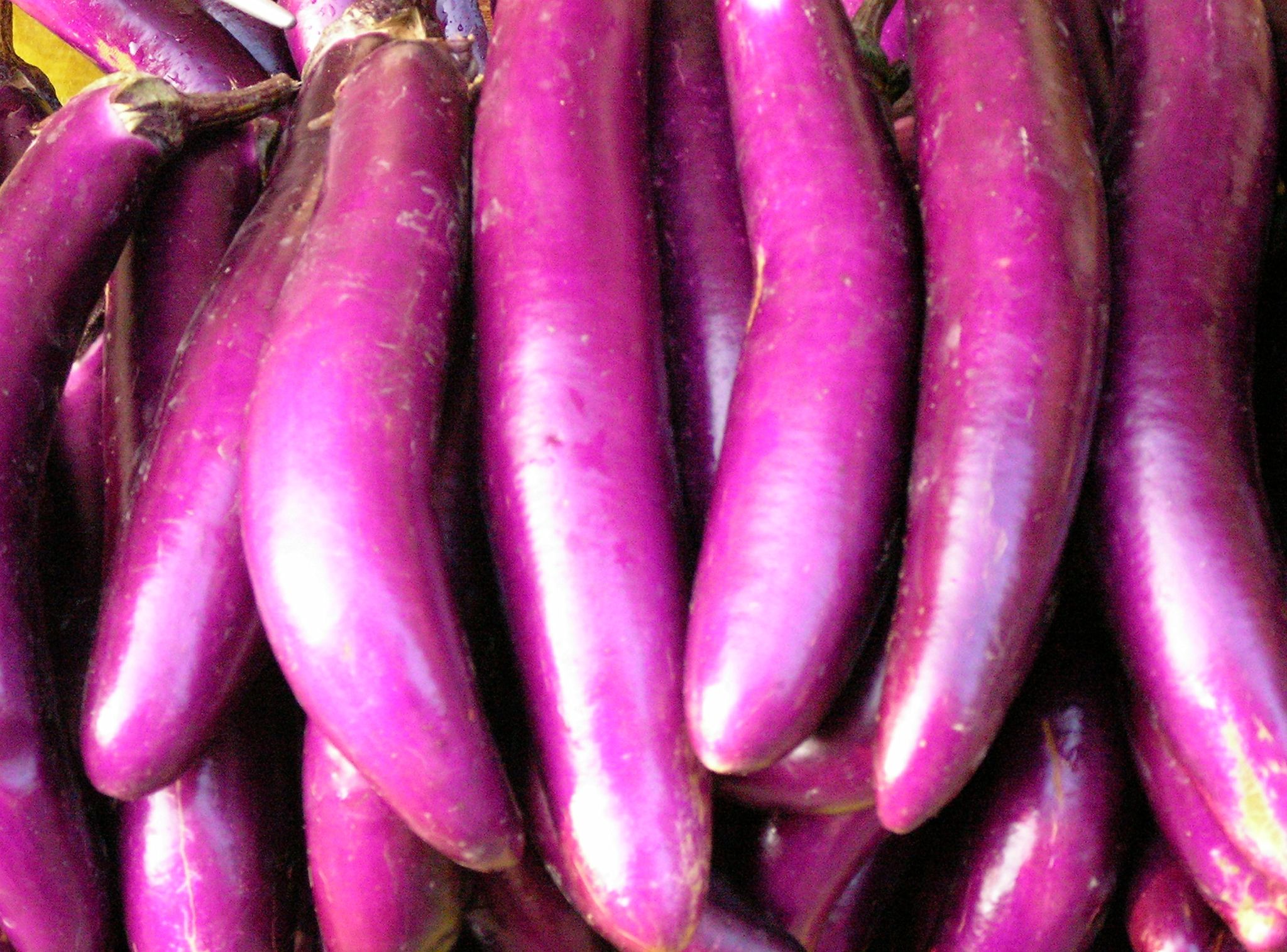 a close up of purple bananas that are still ripe