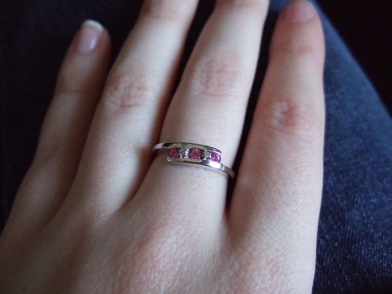an unhealthy ring, with two stoned rings sitting on the top finger