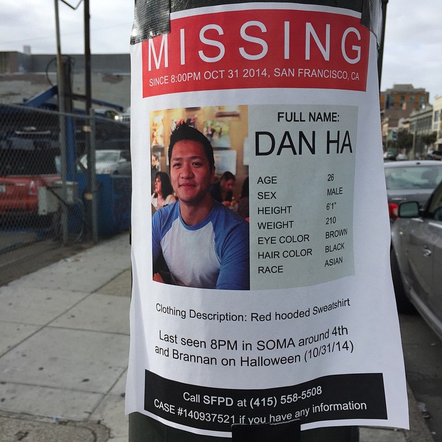 a missing person card taped to a pole