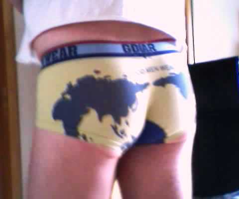 someone's  wearing trunks with a map on them