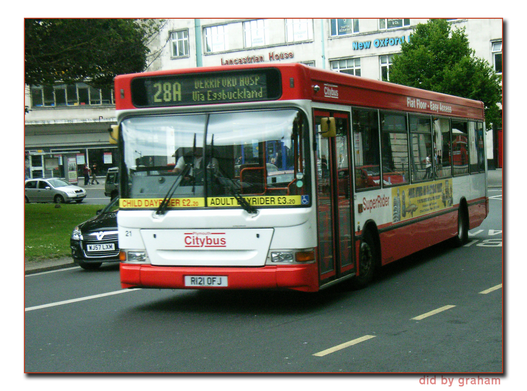 there is a city bus in the street