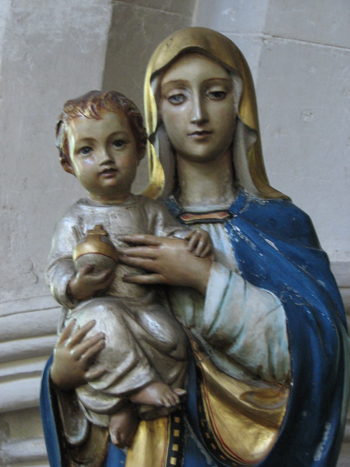 an image of a statue of a woman holding a baby
