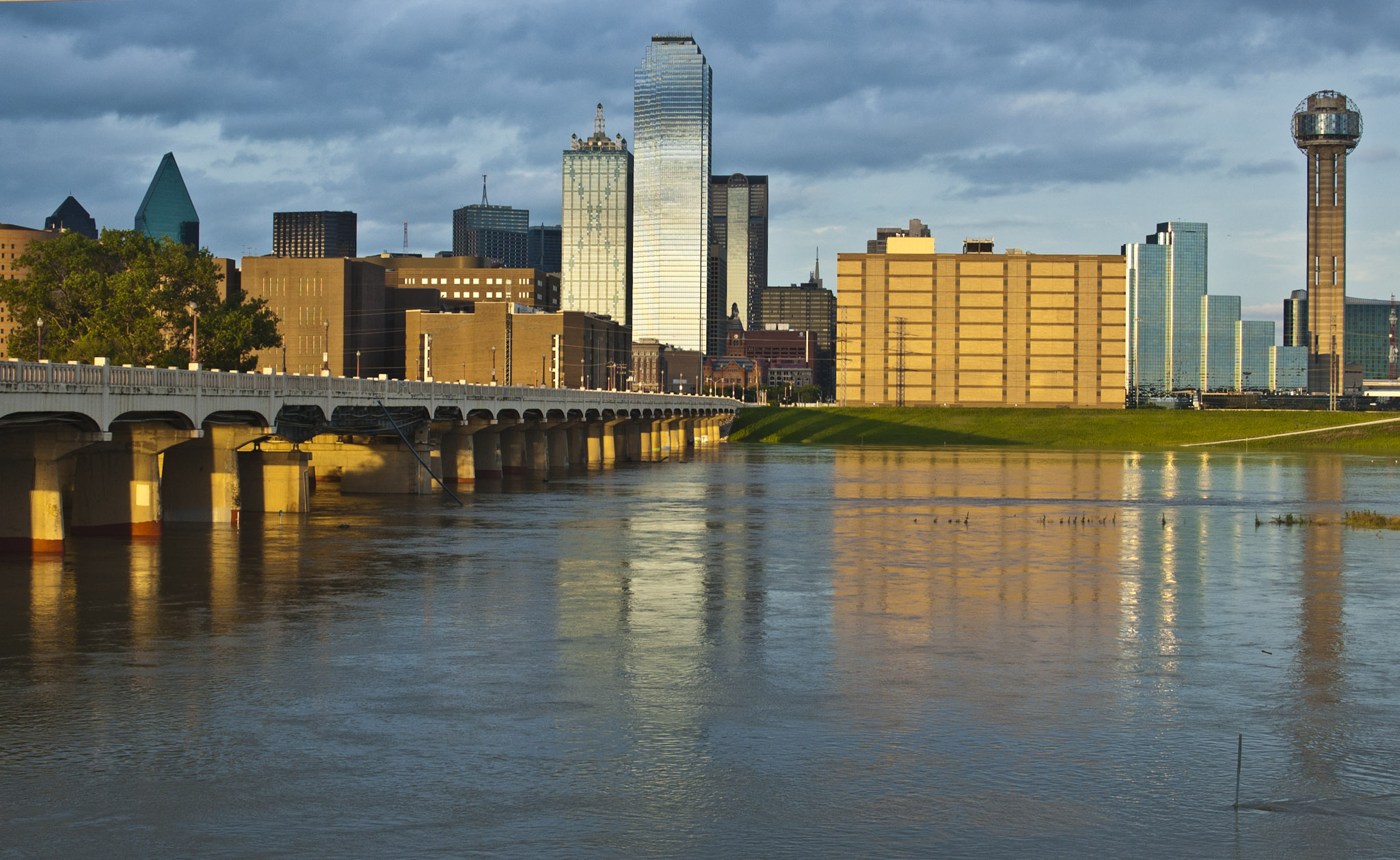 the skyline of buildings reflected in the water