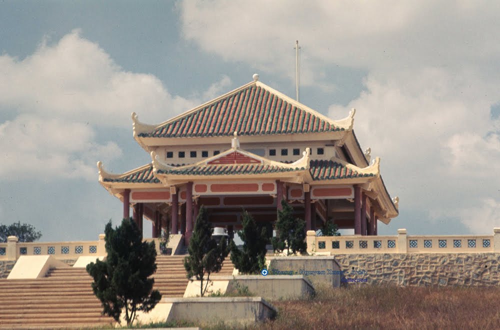 the pagoda on top of a building has a balcony