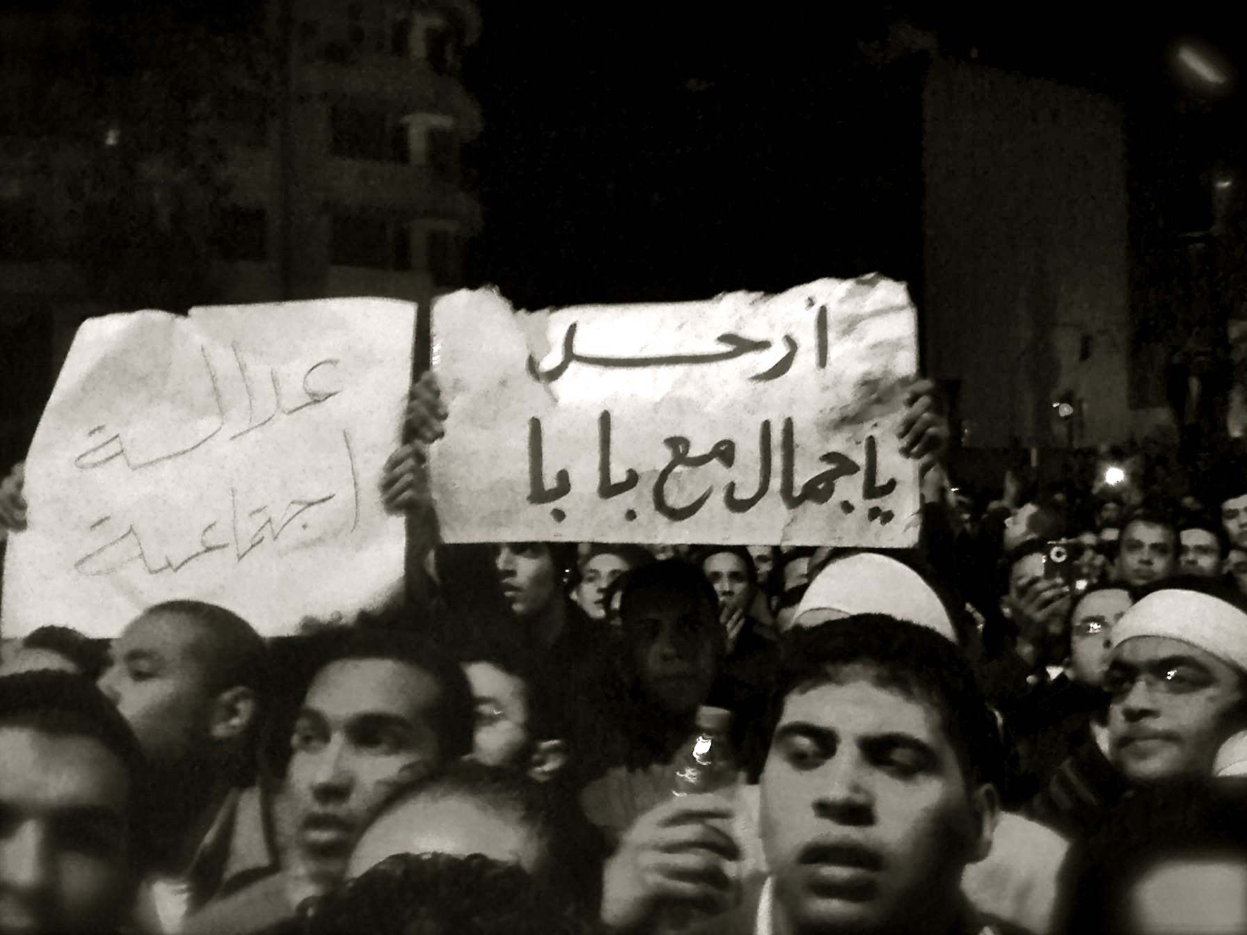 a group of people holding up a placard