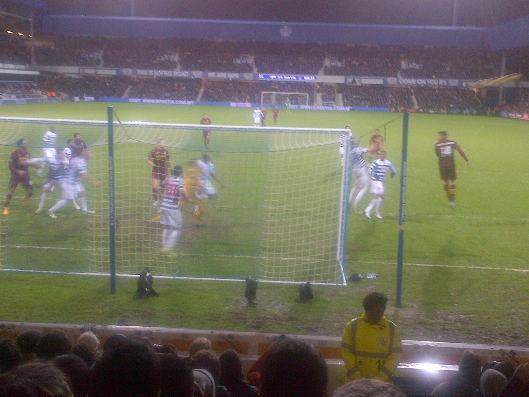 two soccer players are standing in front of the goal