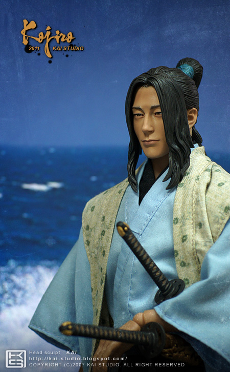 an action figure of a man dressed in the japanese style