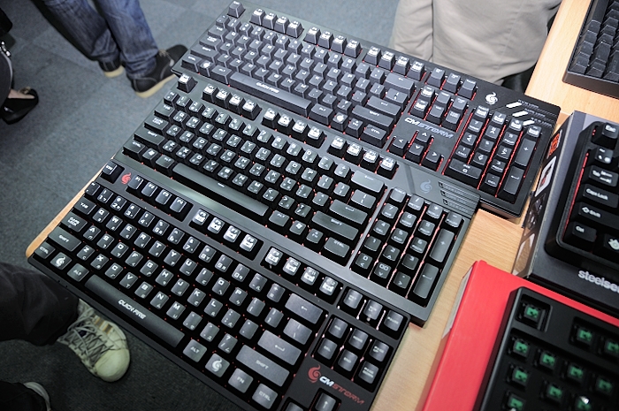 the computer keyboards are lined up on the desk