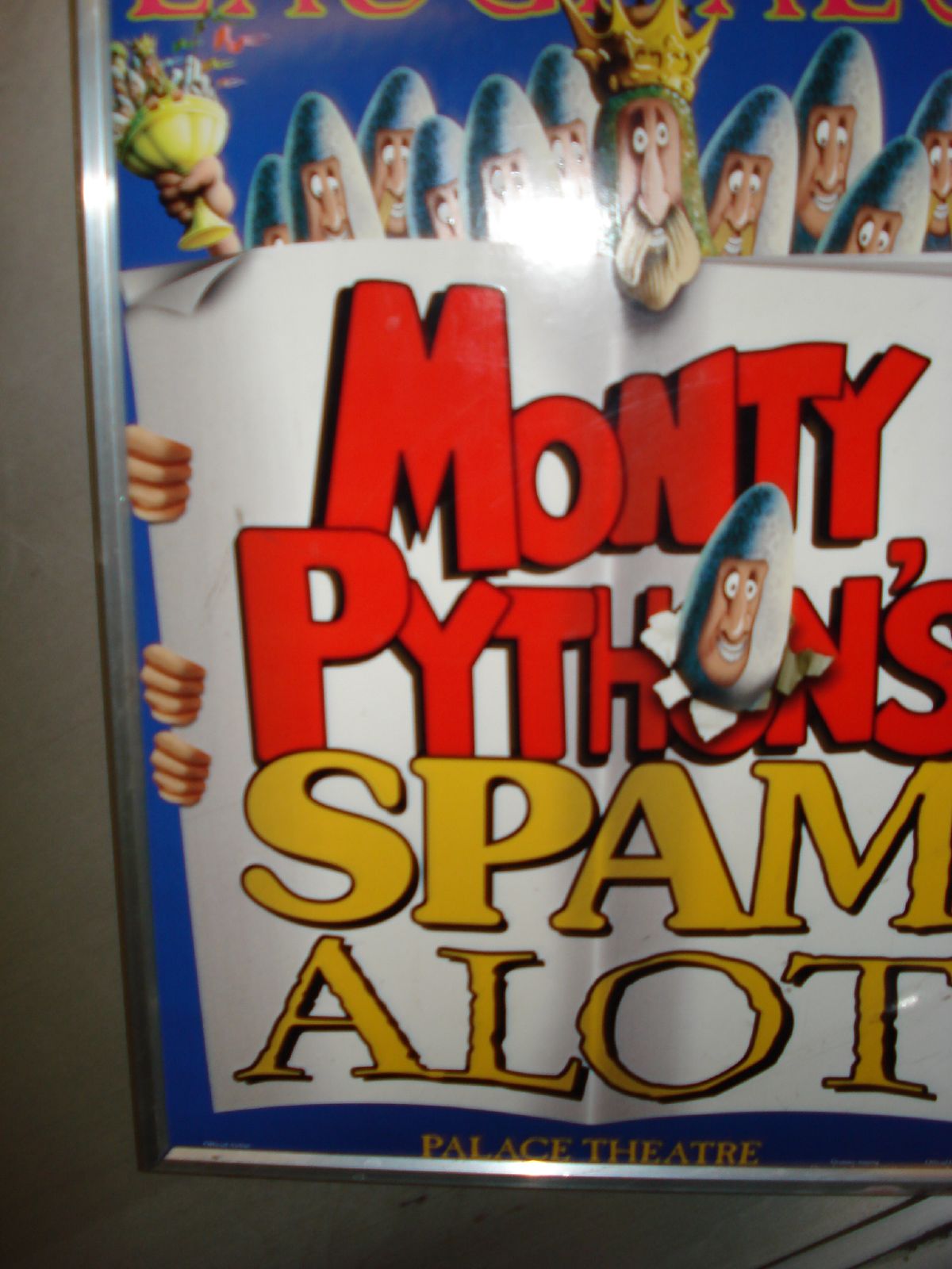a sign on the wall advertising spam alot