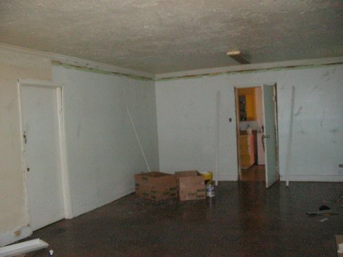 a view of an empty room with white walls