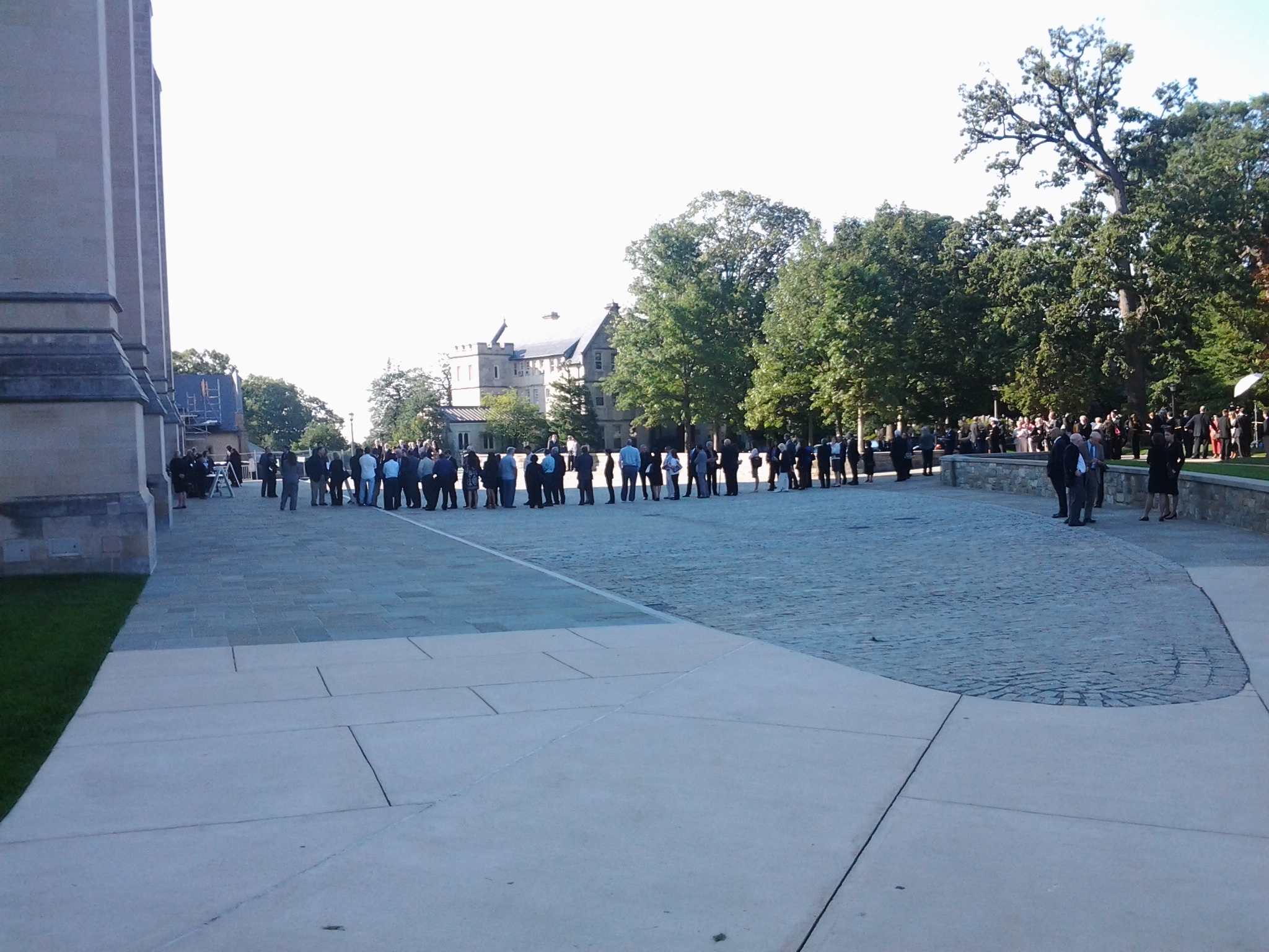 a group of people standing in the middle of the street