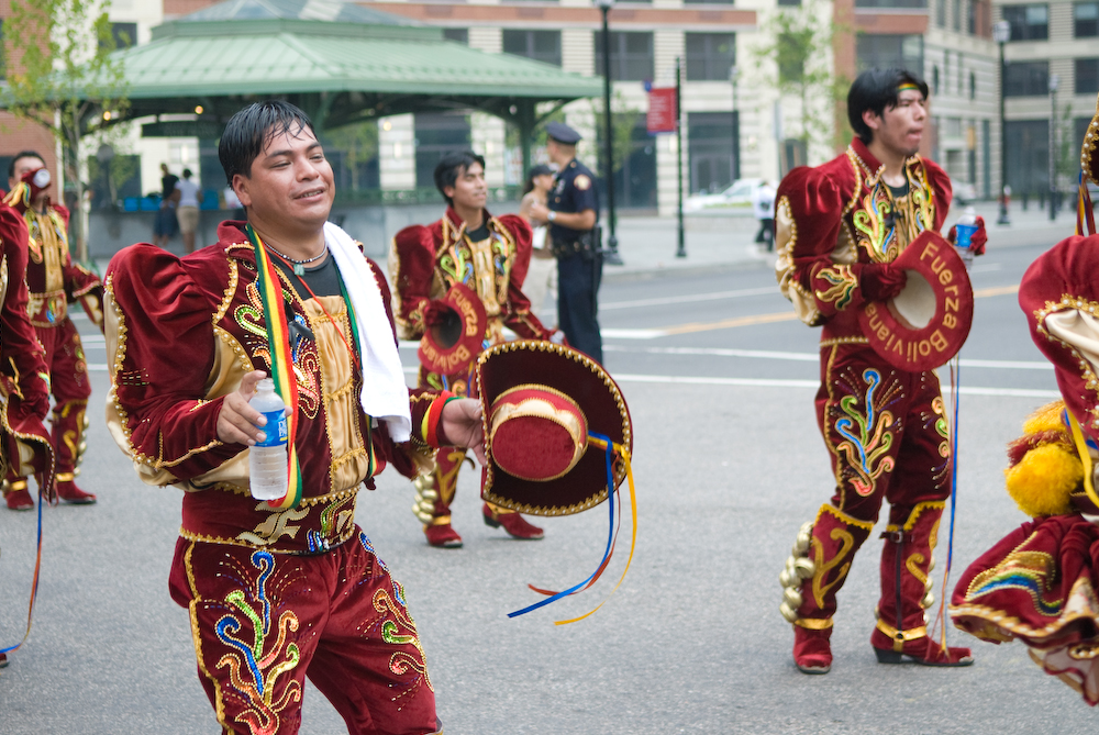 young men in oriental clothing with drum sticks