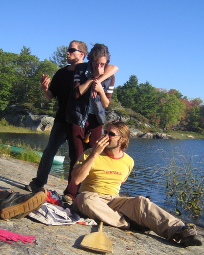 some people are by the water and are standing