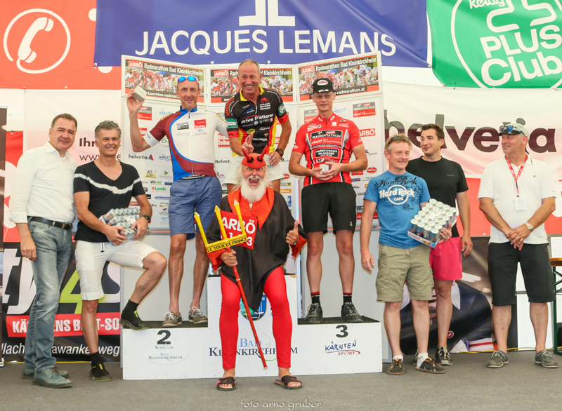 several people are holding on to their trophies while on stage