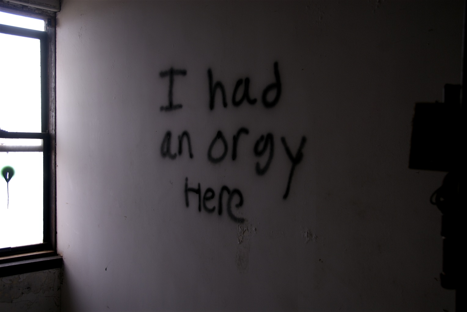 a message written on the wall of an empty room