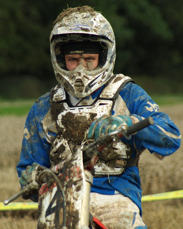 a man riding on the back of a dirt bike