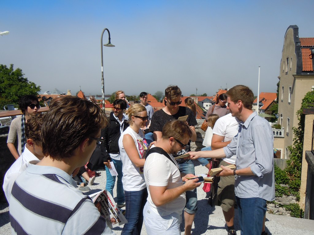 a group of people standing together on a roof