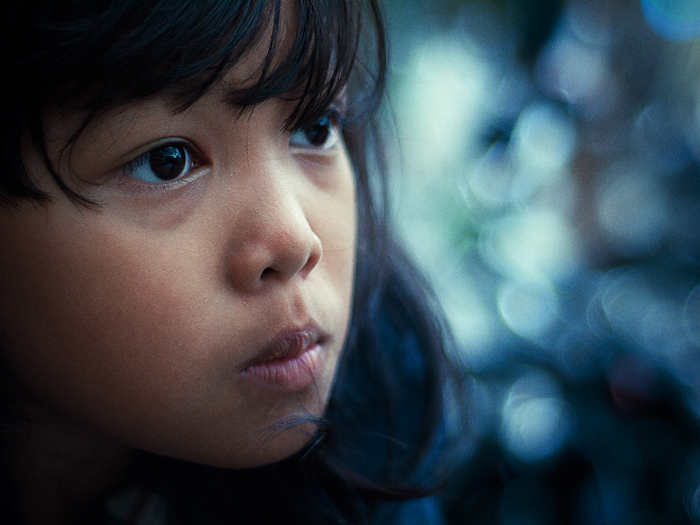 a young child's head is shown with black hair