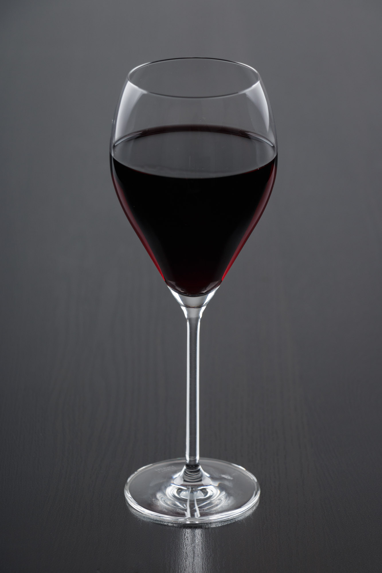 an almost empty glass of wine is seen