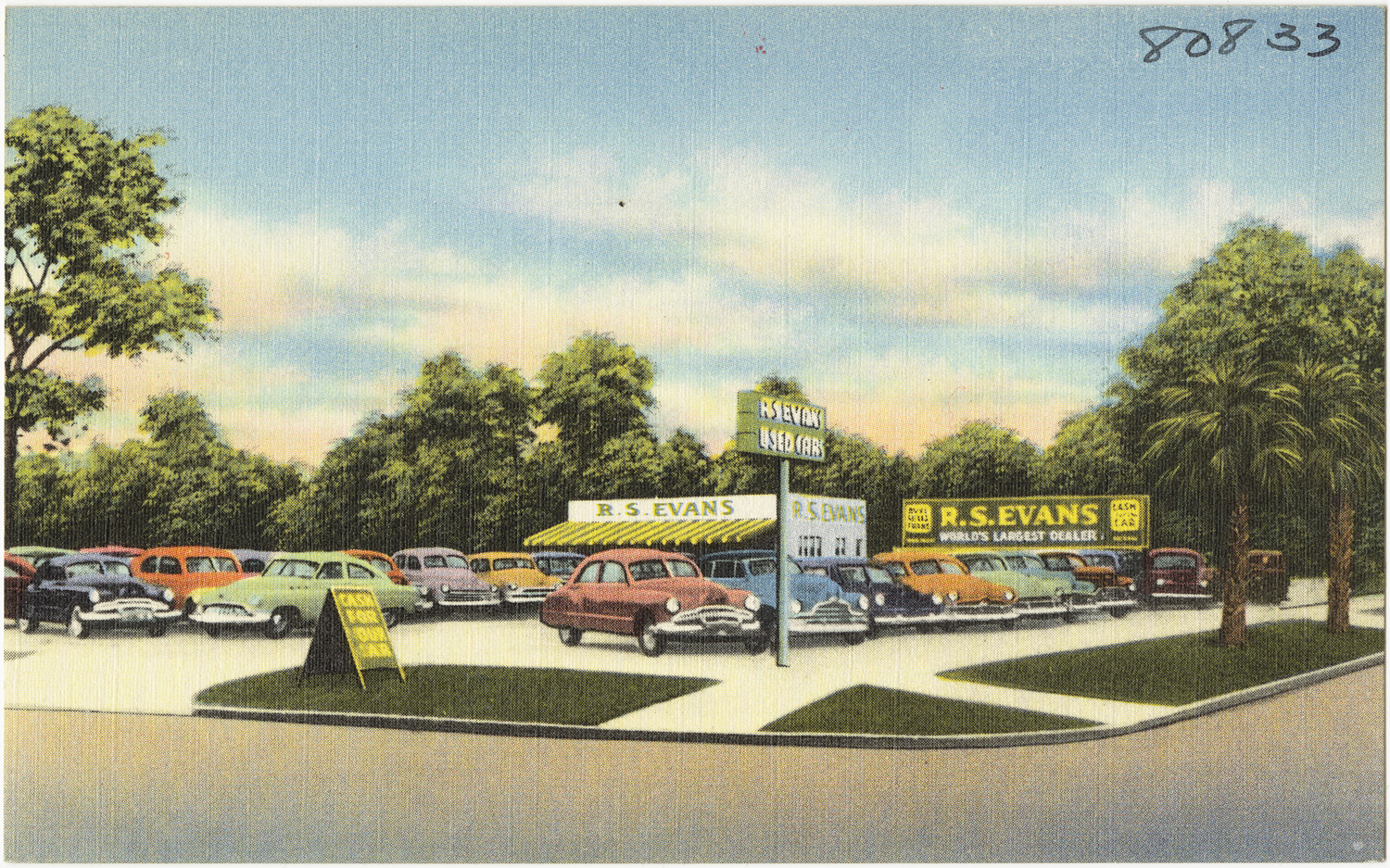old postcard depicting cars parked at a gas station