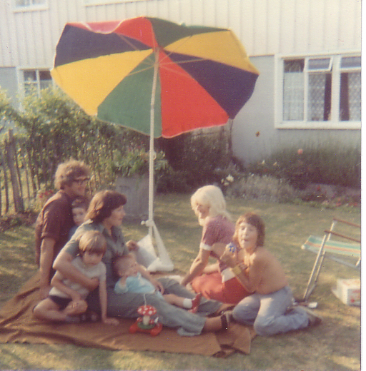 an image of family gathering at a back yard