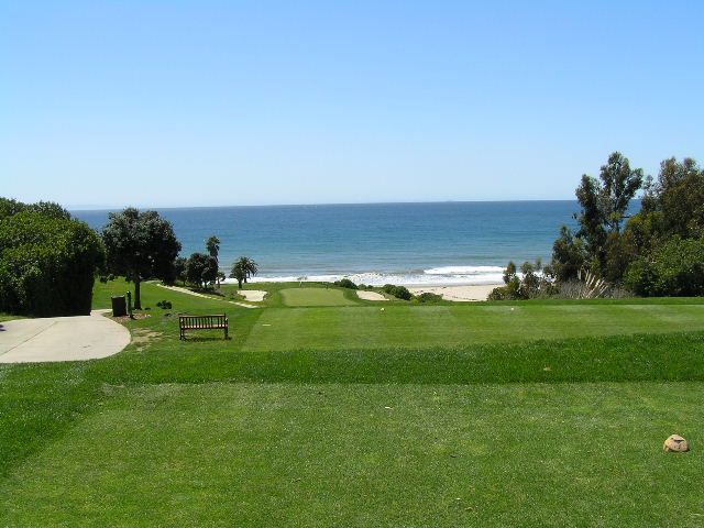 a view of the ocean and golf course