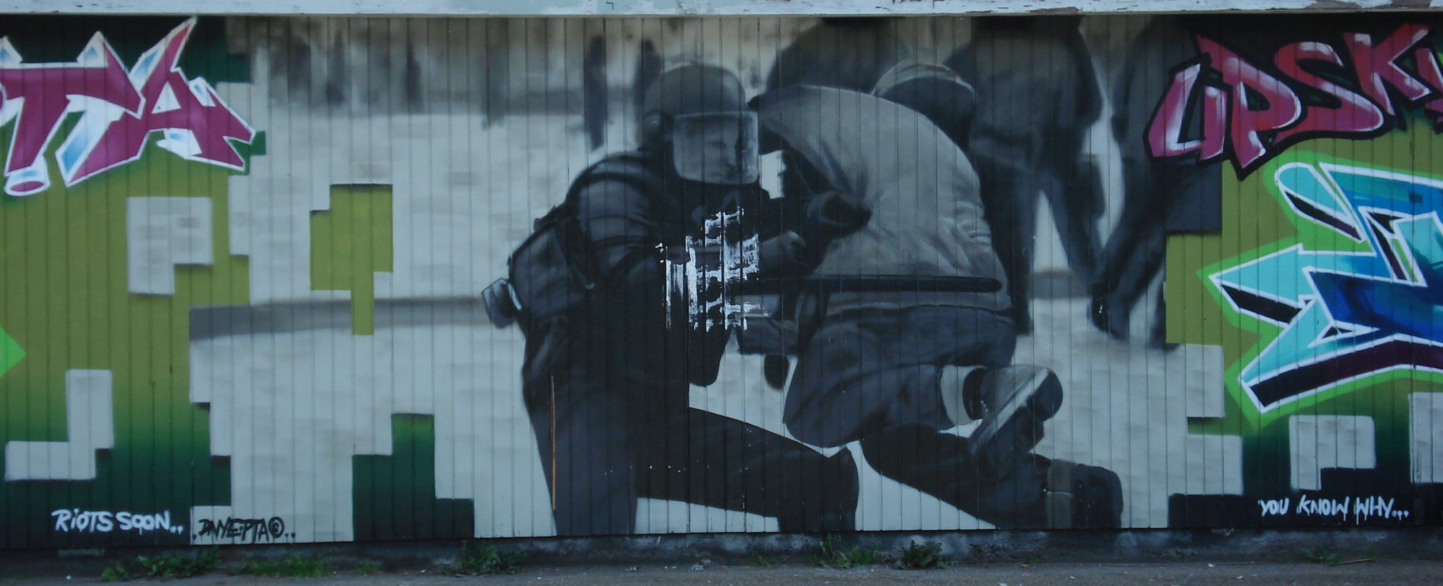 a mural of a couple dancing against a green background