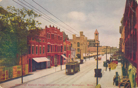 an old time image of trolley tracks and street vehicles