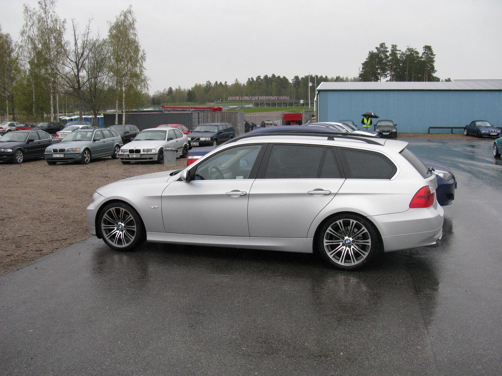 a silver and black car parked on a parking lot