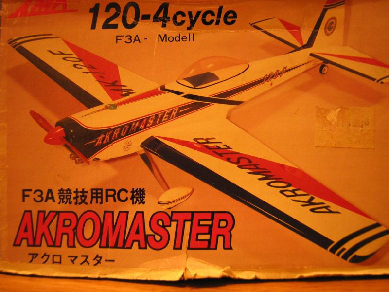 a box is opened to reveal a plastic model airplane