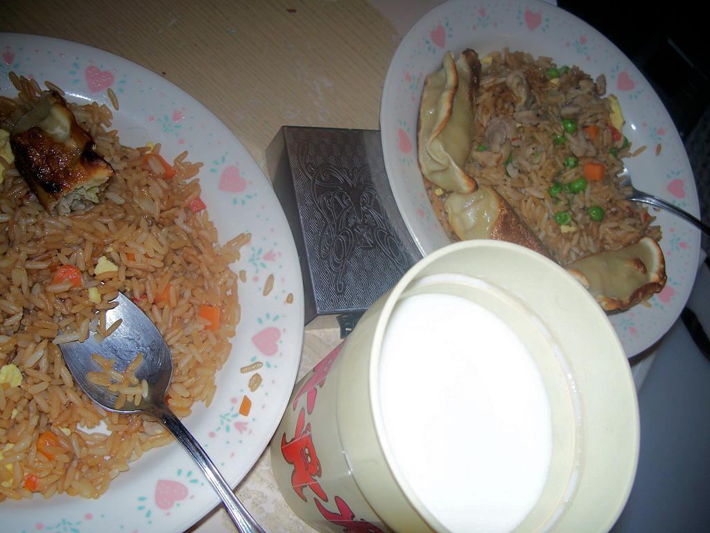 two plates on a table with food in them and a drink