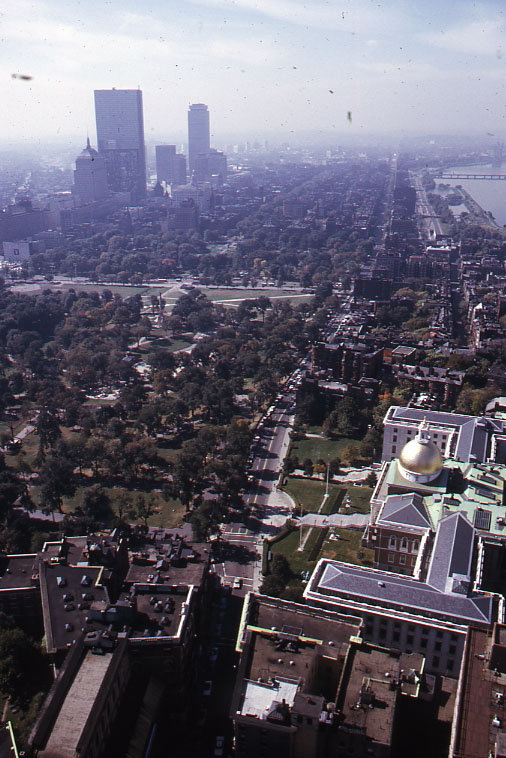 an aerial view of a city, looking down from a tall building