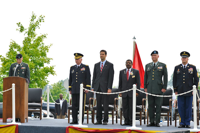 some people in military uniforms are standing on stage