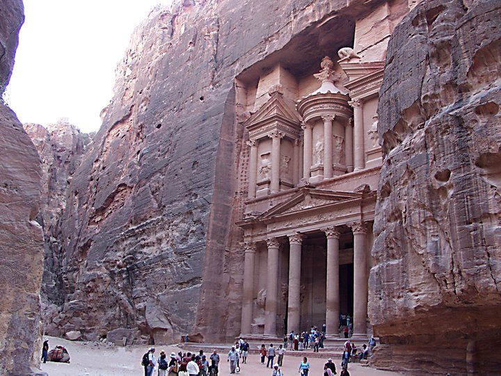 the tourist are at the grand entrance to a temple