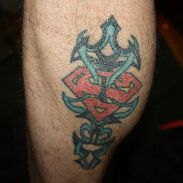 closeup view of tattoos that have many designs on the thighs