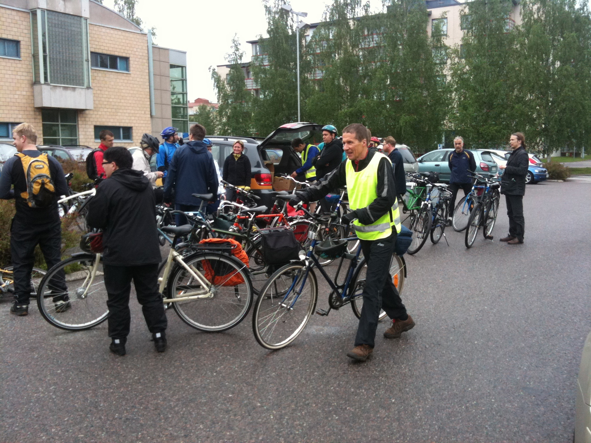 a group of men standing in front of bicycles