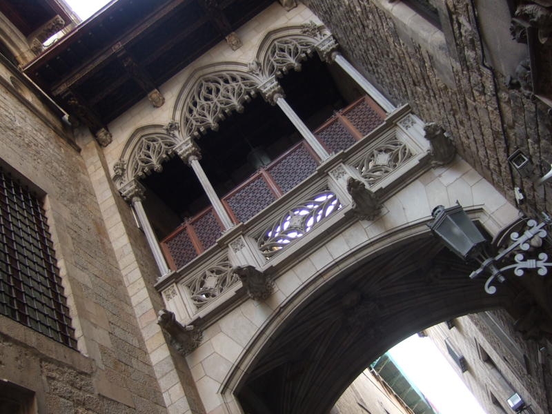 the building is tall and has two balconies