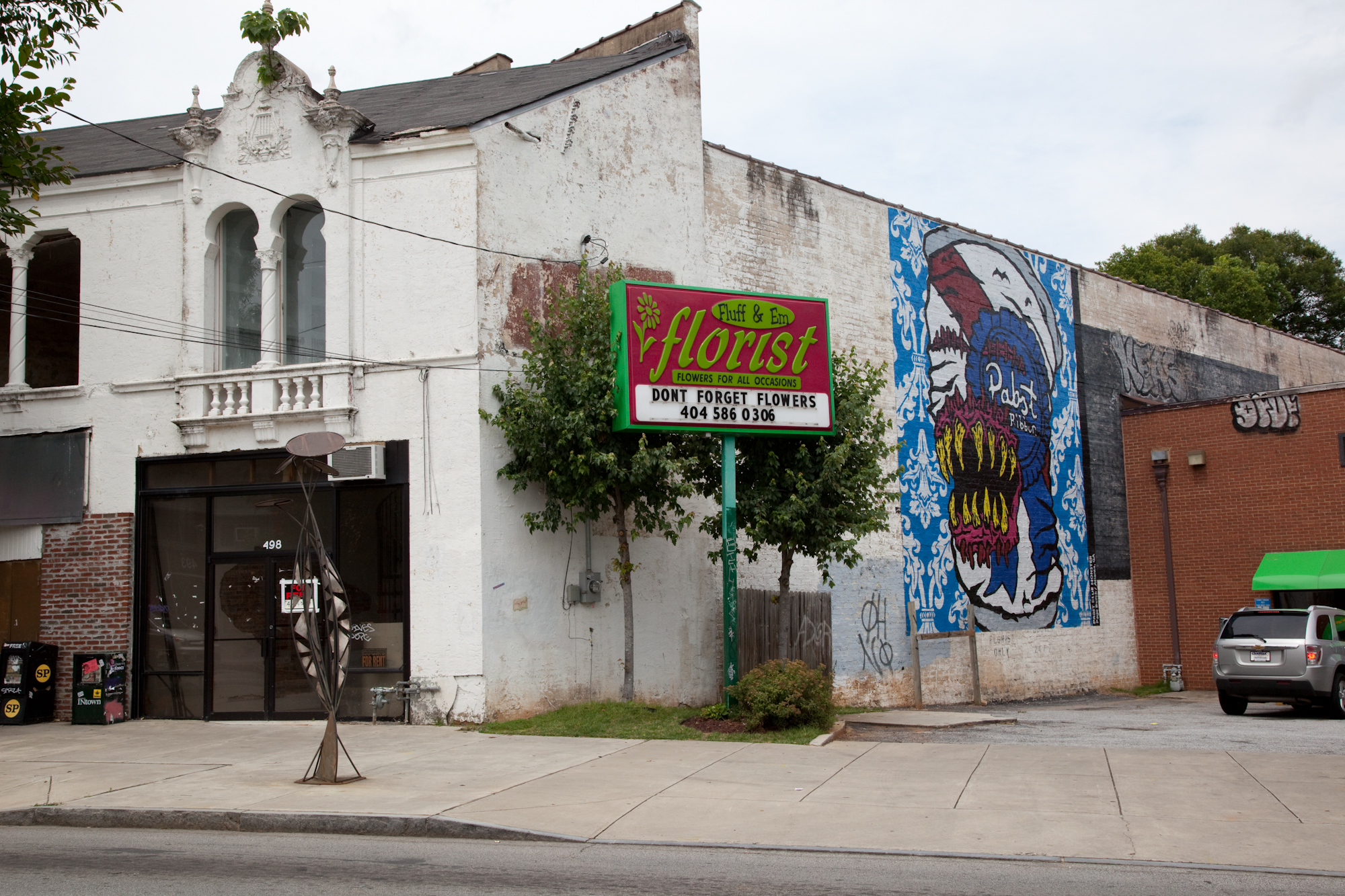 an old brick building with graffiti on it