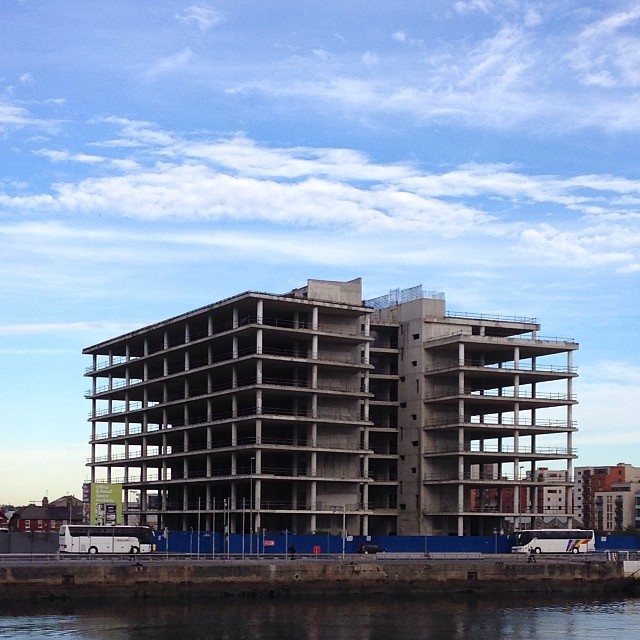 a large building that is under construction near the water