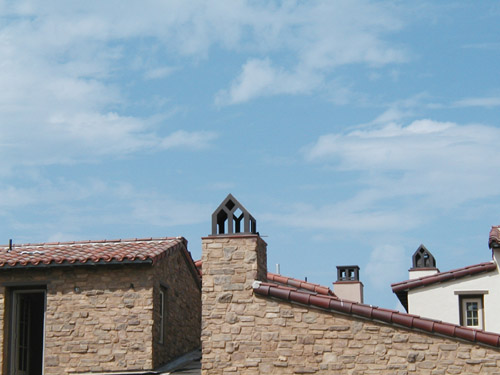 the roof of the building with a large clock tower