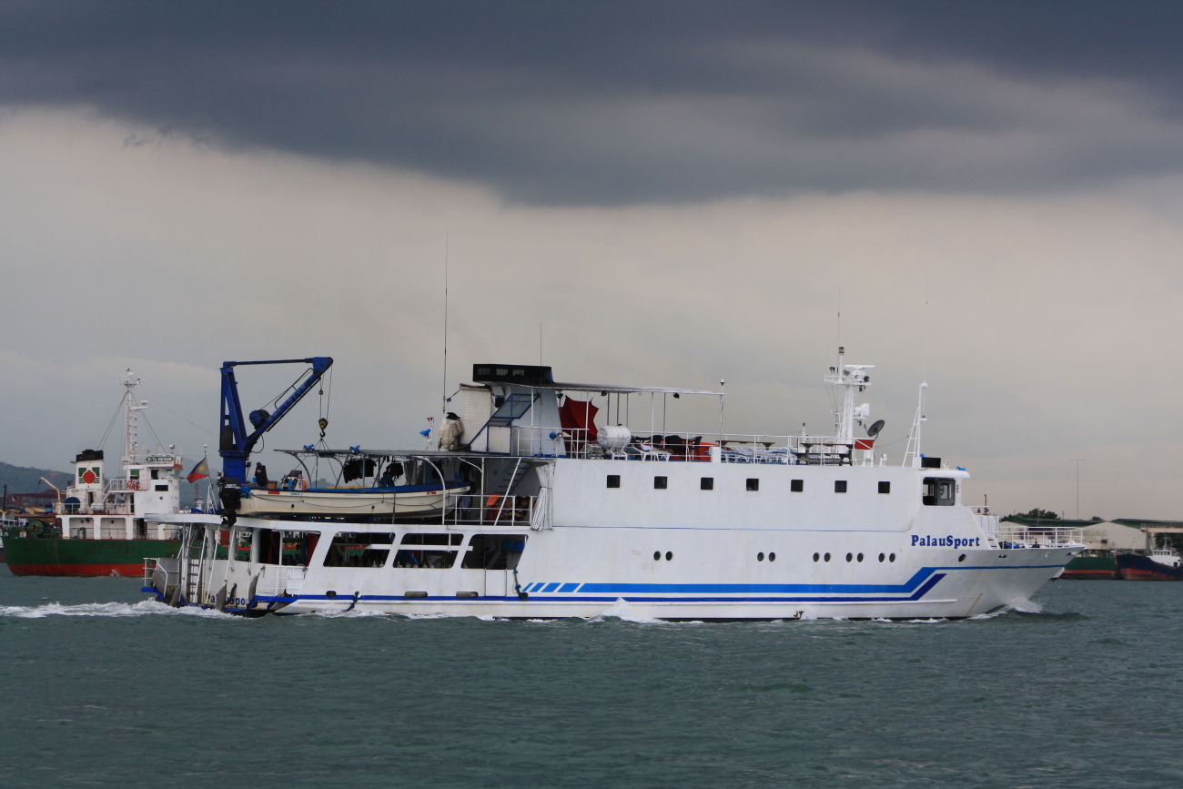 large white and blue boat traveling in the ocean