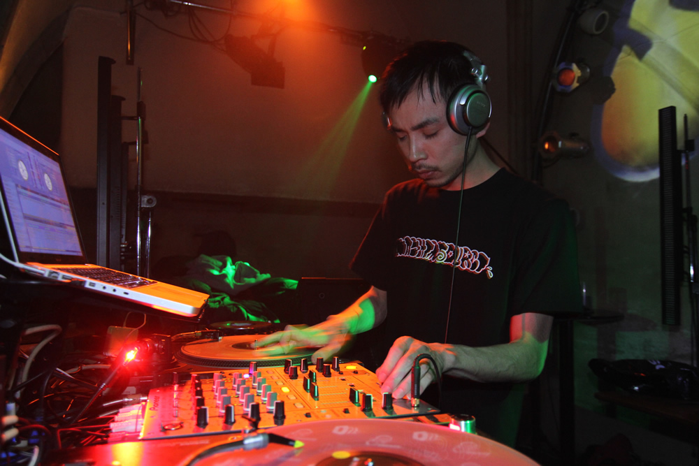 a dj using two controls to record music