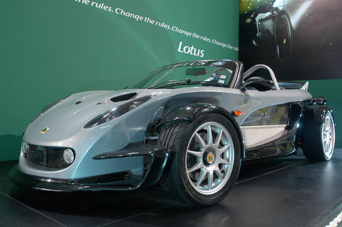 a blue sports car sits on display for customers