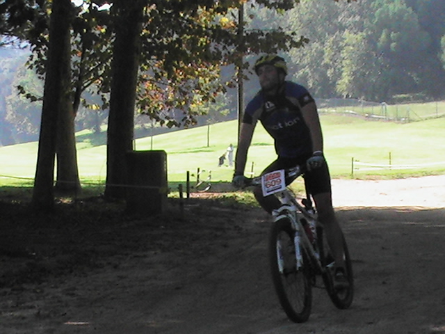 a man is riding a bicycle in the dirt